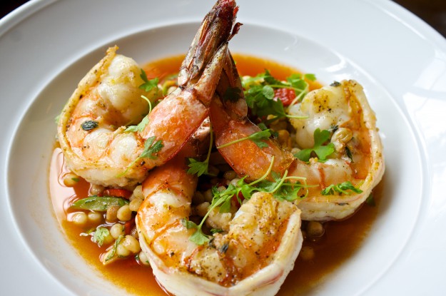 Shrimp with Couscous, Piquillo Pepper, Marcona Almond, and Harissa Broth at The Riggsby
